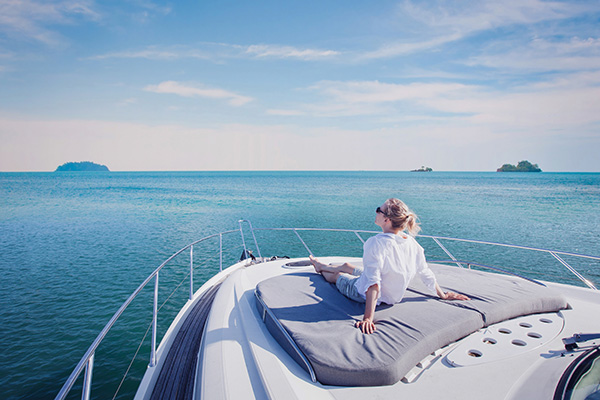 beautiful woman enjoying luxurious yacht